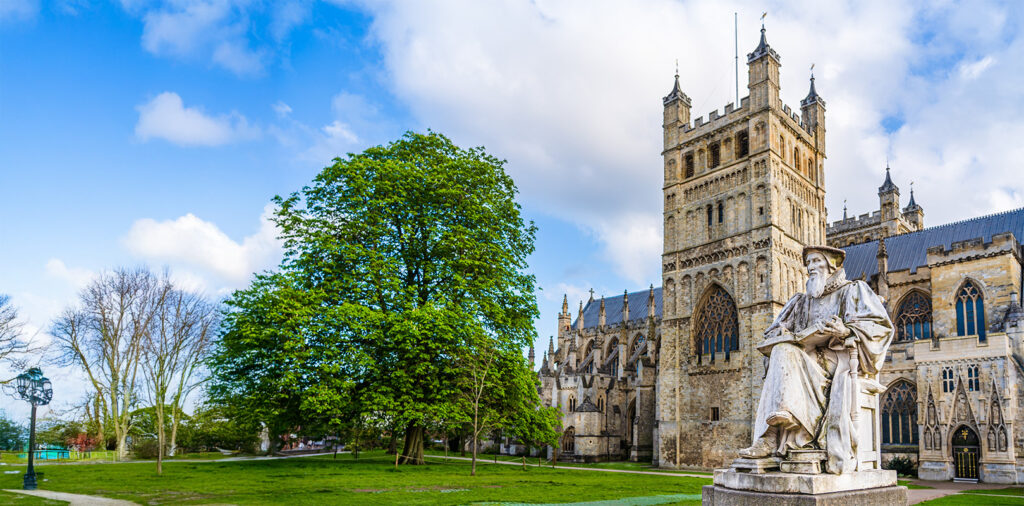 This is a view of Exeter Cathedral, a medieval Gothic cathedral located in Devon, England.