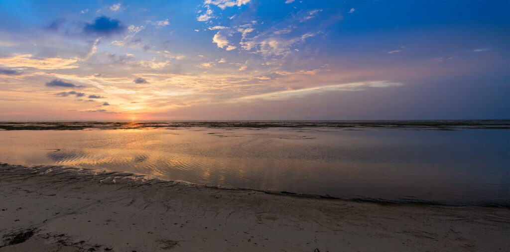 Sunset during low tide in Patar Beach